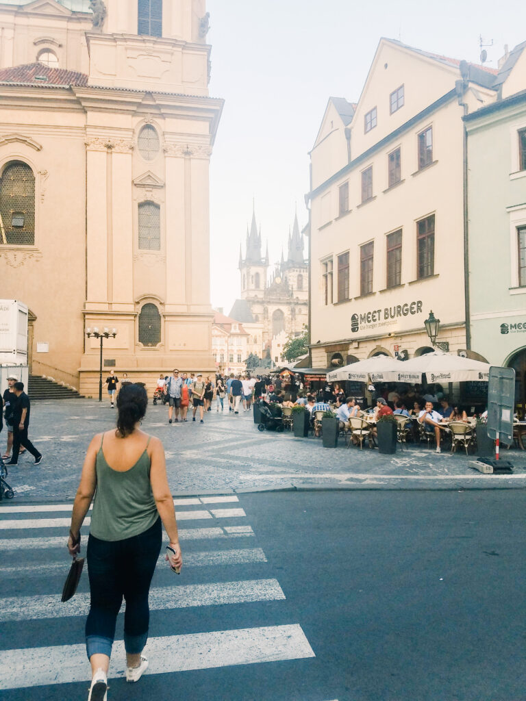 Strolling across the street in Prague. Check out these guide to unique and cool things to do in Prague.