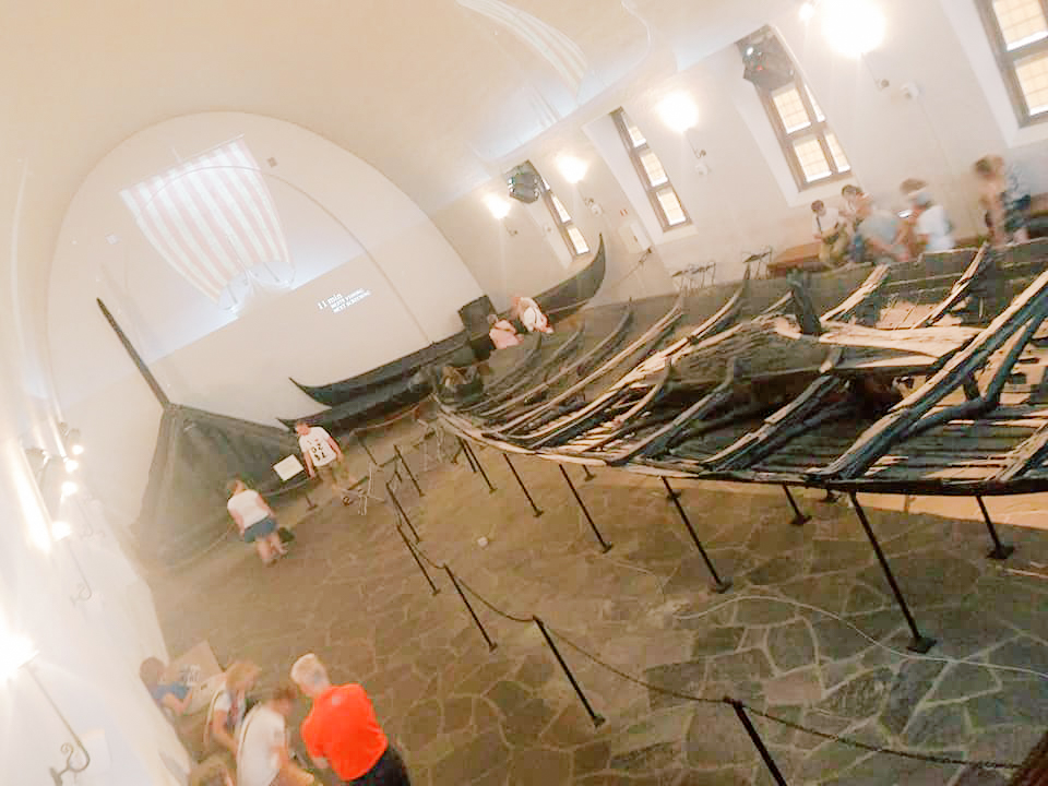 Excavated Viking ships on display in a museum 