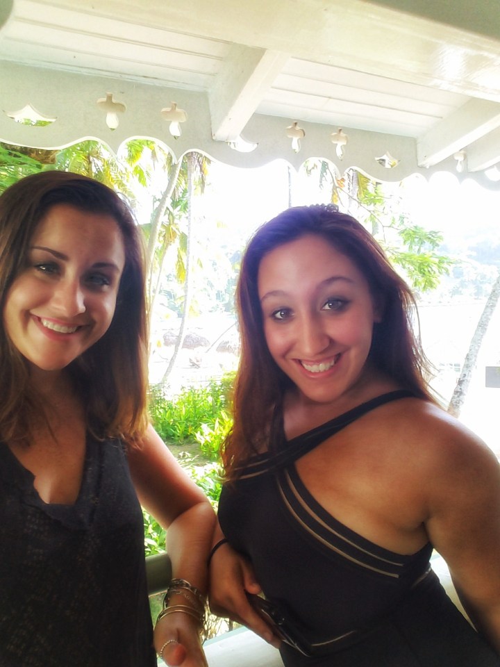 Two girls are all smiles as they are about to embark on the ultimate girls weekend. They stand on their hotel balcony taking a selfie. It's OK to have a weekend in St Lucia with a friend! 