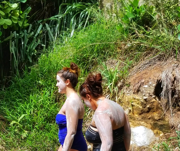 Two women entering the sulfur springs in Soufriere