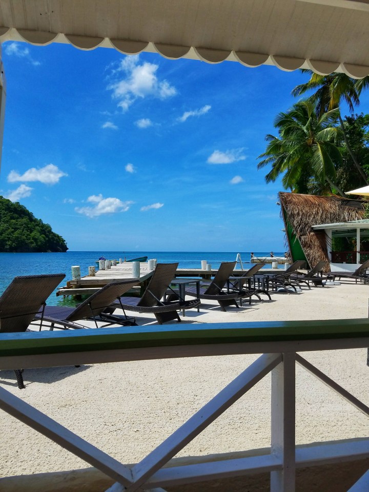 Lounge chairs on the beach at a resort in St Lucia