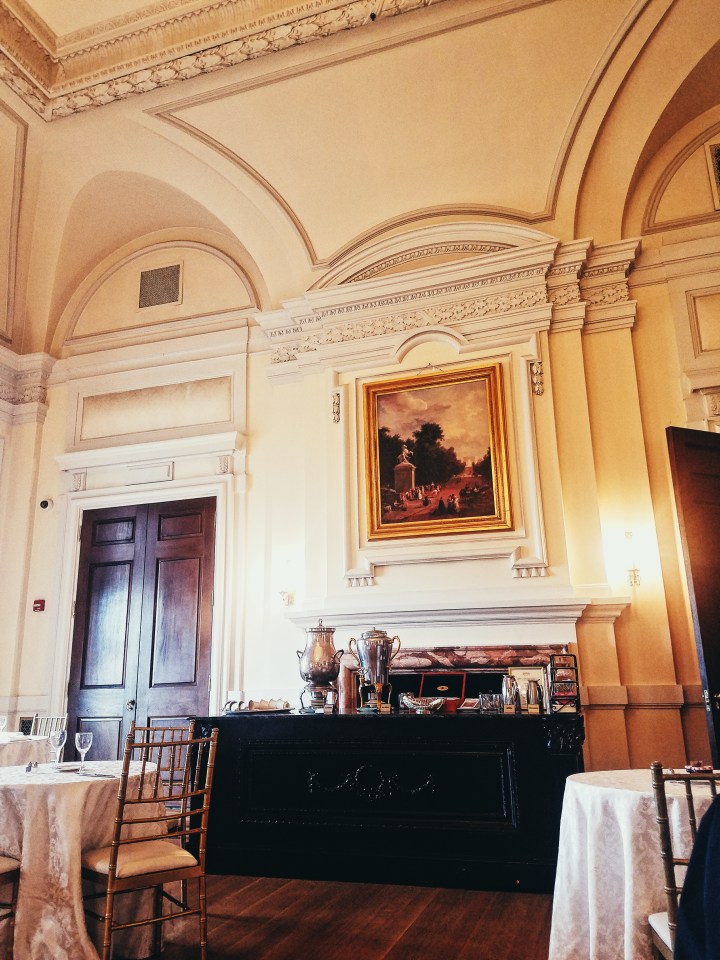 Tea station in grand ballroom with giant painting above at Oheka Castle on Long Island