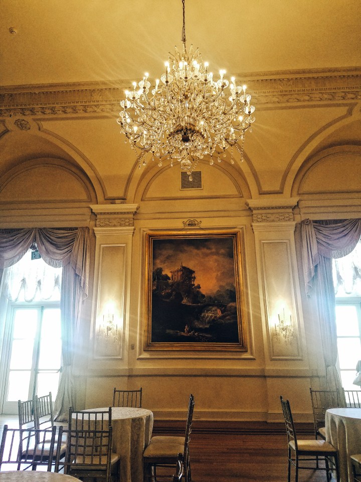 Gatsby themed dining room with chandelier in Oheka Castle on Long Island