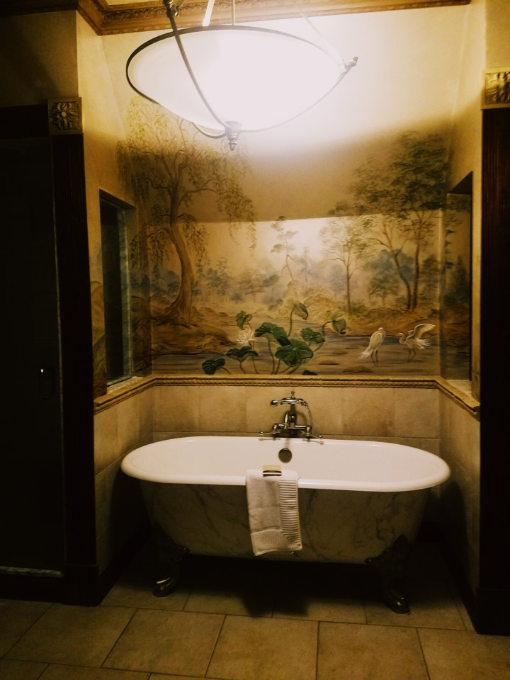A Gatsby themed 1920's detailed bathroom with clawfoot tub at Oheka Castle on Long Island