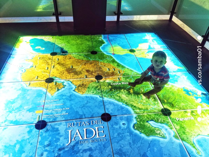 A child sits on an interactive map in the Jade Musem