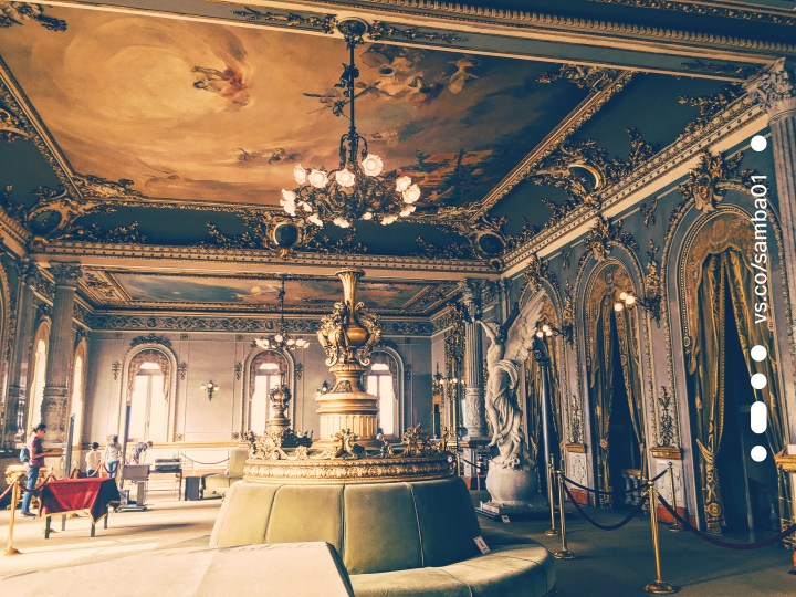 The reception room of the Costa Rica national theater. It is in the style of a European theater and adorned in gold/