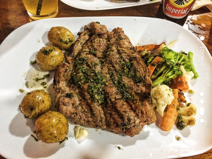 A plate with steak, potatoes, and vegetables. 