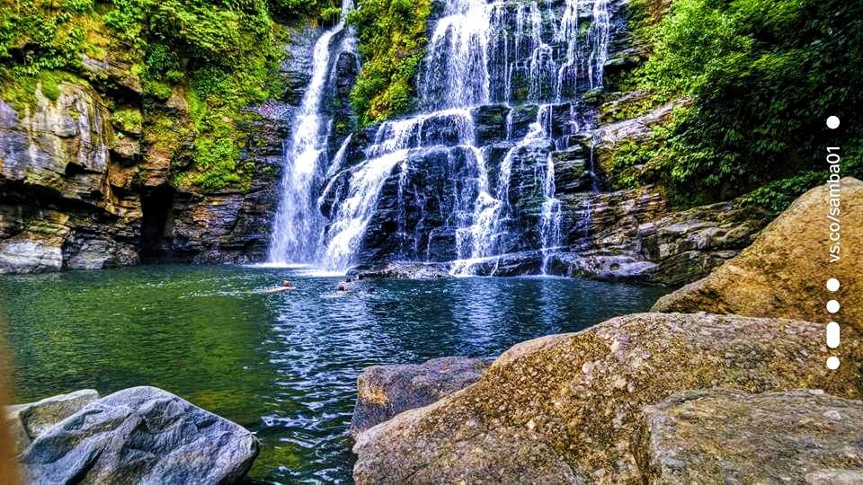 A waterfall flowing into a pool