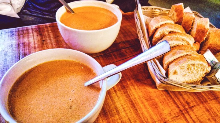 Two cups of lobster soup and a basket of bread served at Saegrefinn in Reykjavik, Iceland