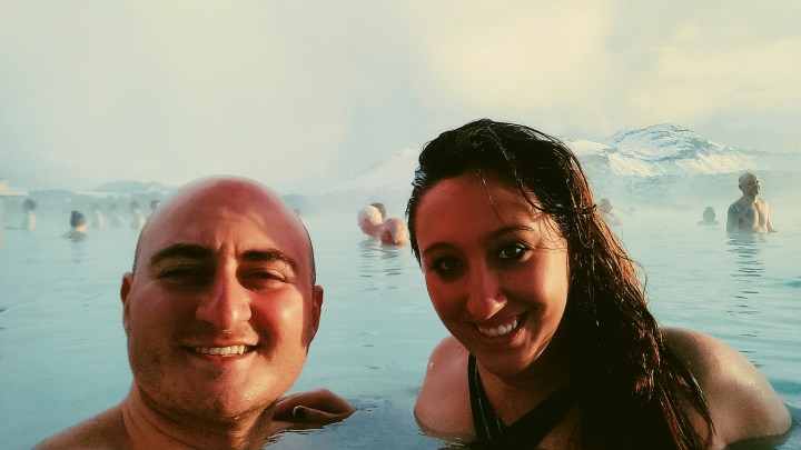 A man and woman take a selfie in the Blue Lagoon