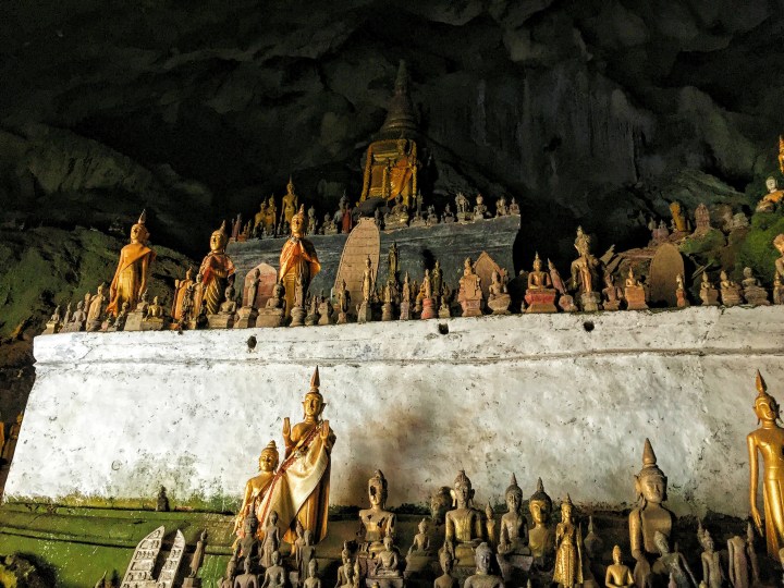 Thousands of Buddha statues of various sizes in the Pak Ou caves. 