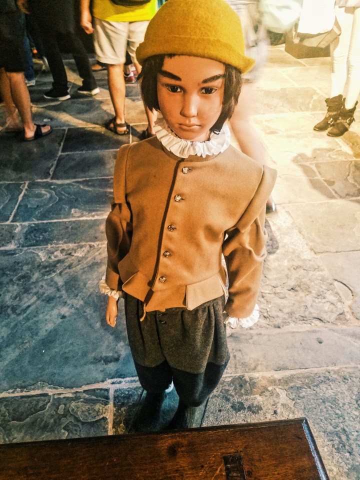 A small recreation figure of William Shakespeare on display