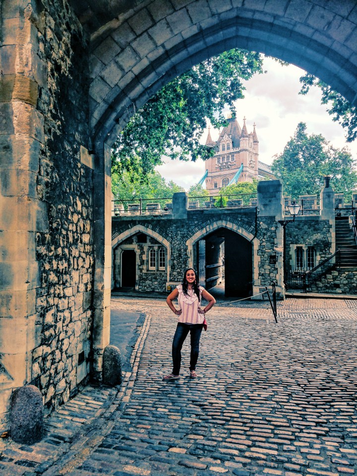 Posing at the Tower of London. Check it out during your first time in London.