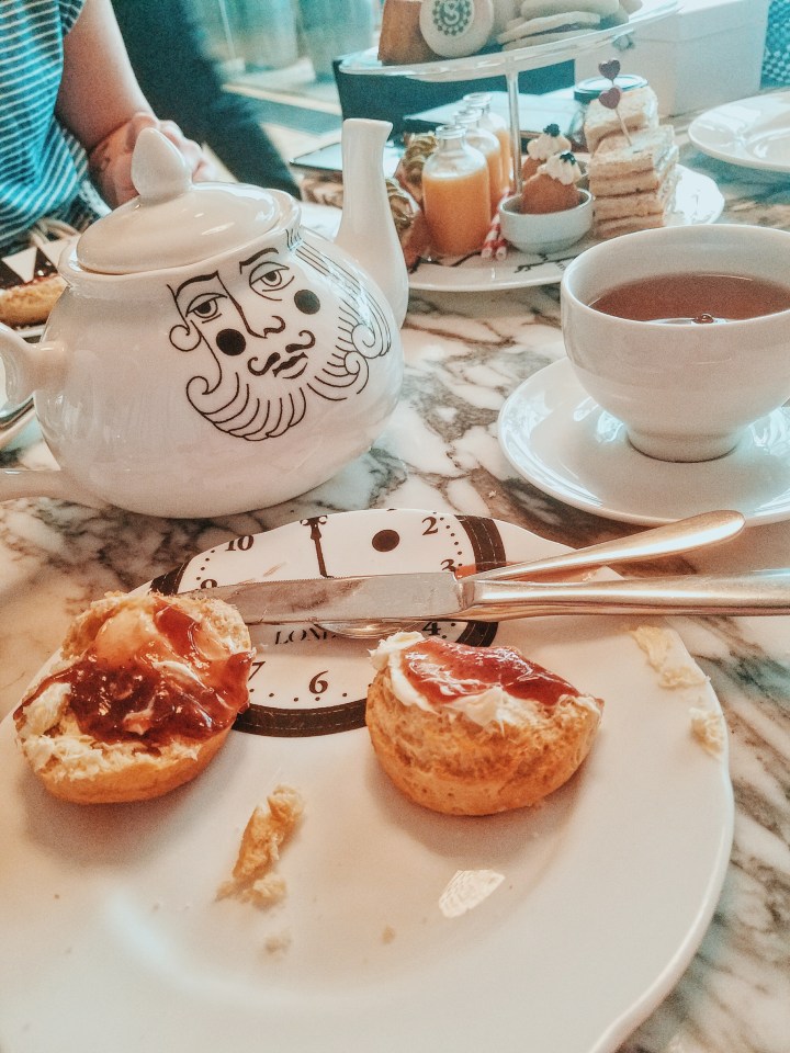 london afternoon tea with scones and mad hatter teapot