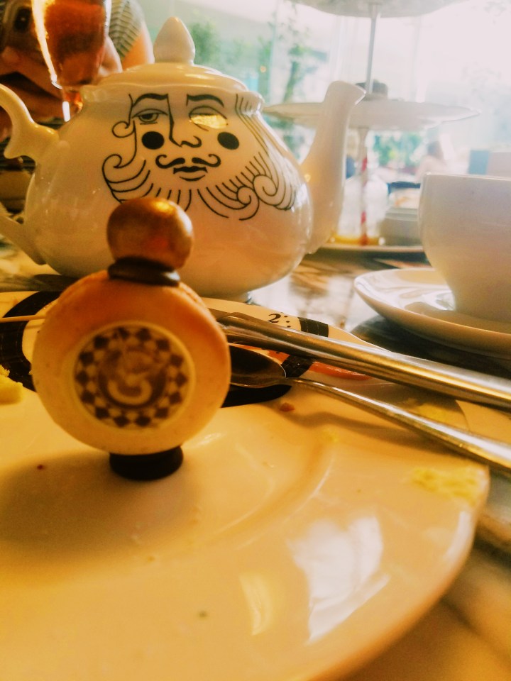 Pocket watch vanilla macaron served at the Sanderson Hotel Mad Hatter's afternoon tea in London