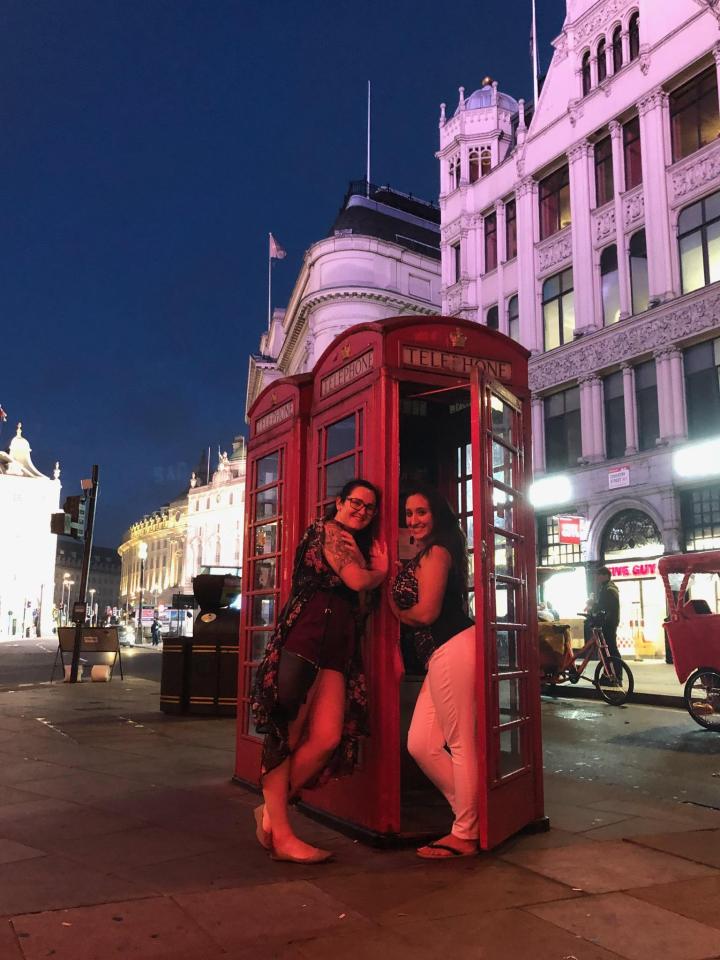 Posing in a red telephone booth in London. Check it out during your first time in London.