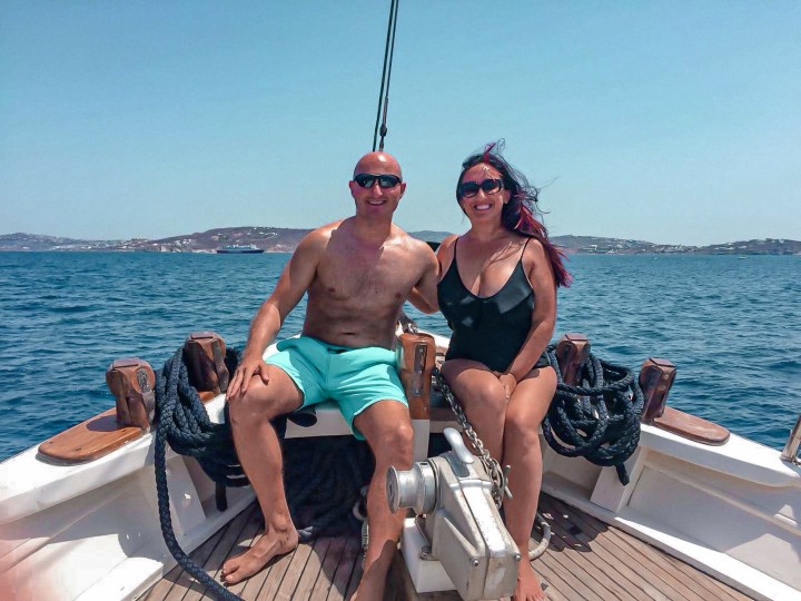 A couple on their honeymoon enjoying being drunk and sailing around Mykonos. 