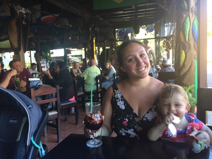 A woman and child at a restaurant while exploring San Jose, Costa Rica