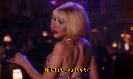 Christina Aguilera flipping her hair in a scene from the movie "Burlesque"
