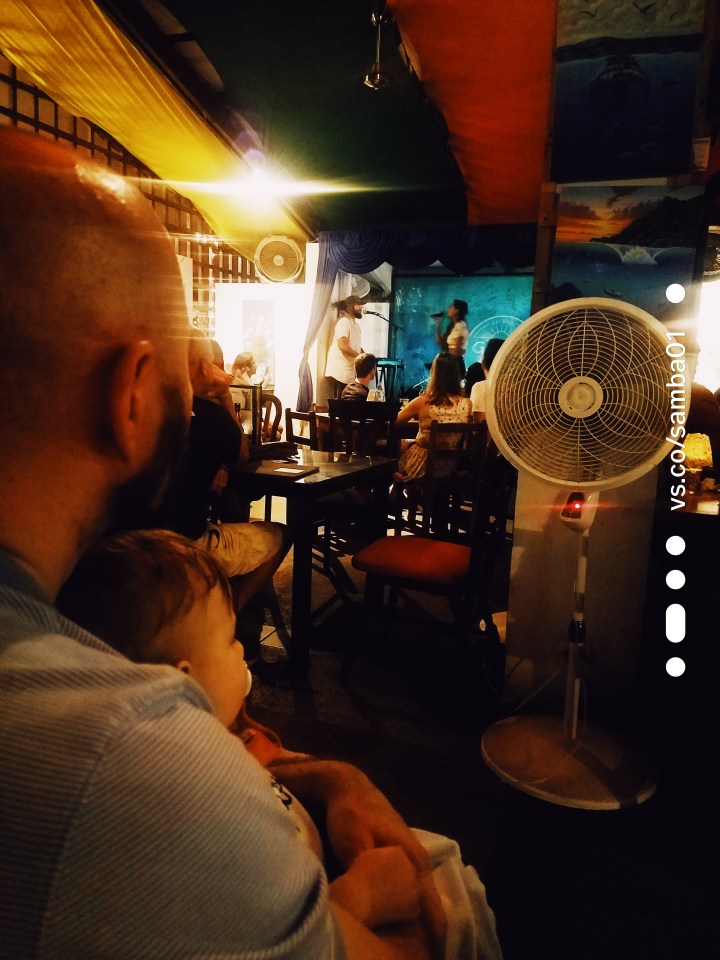 A man and child at a restaurant