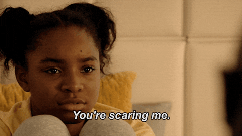 A gif featuring a girl and the text "you're scaring me."