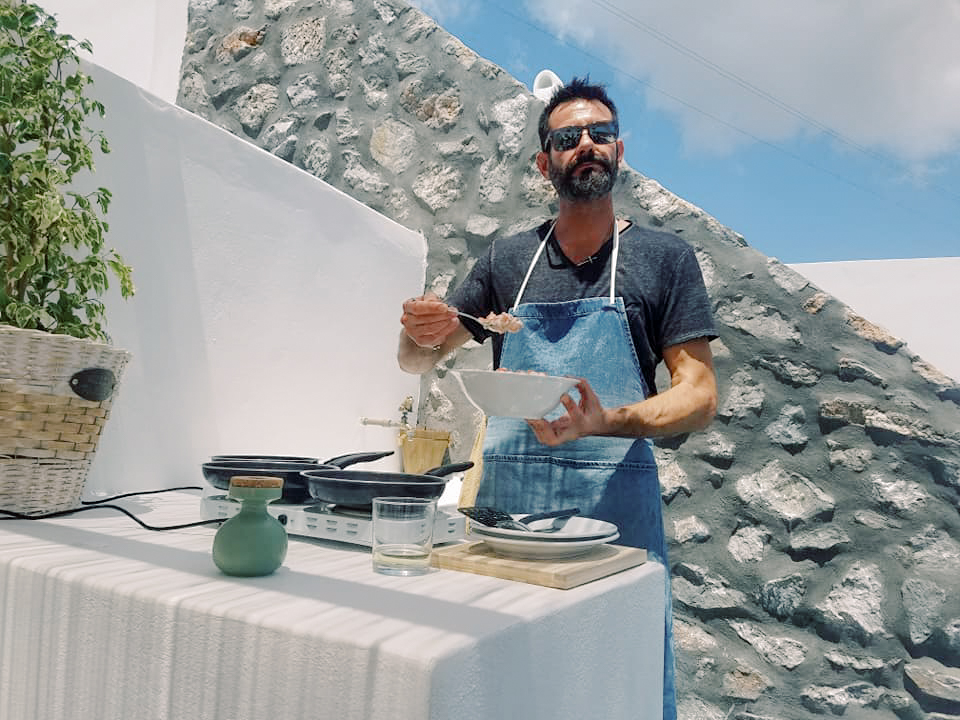 A man cooking traditional Greek dishes 