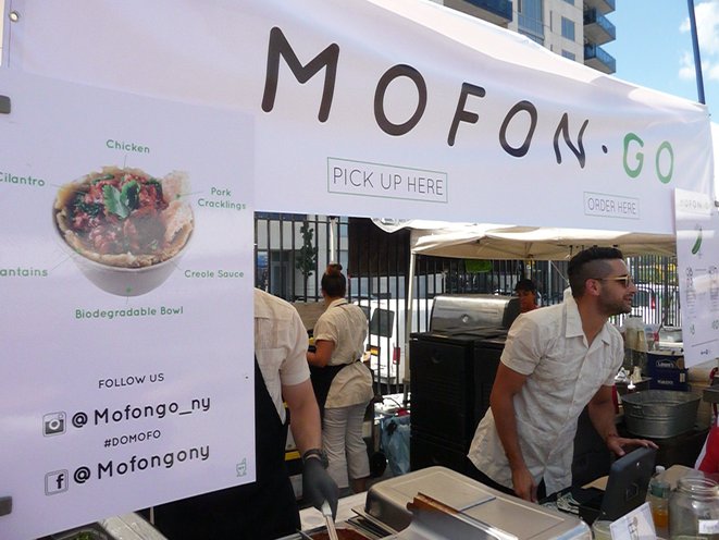 A stall at a food fair offering mofongo