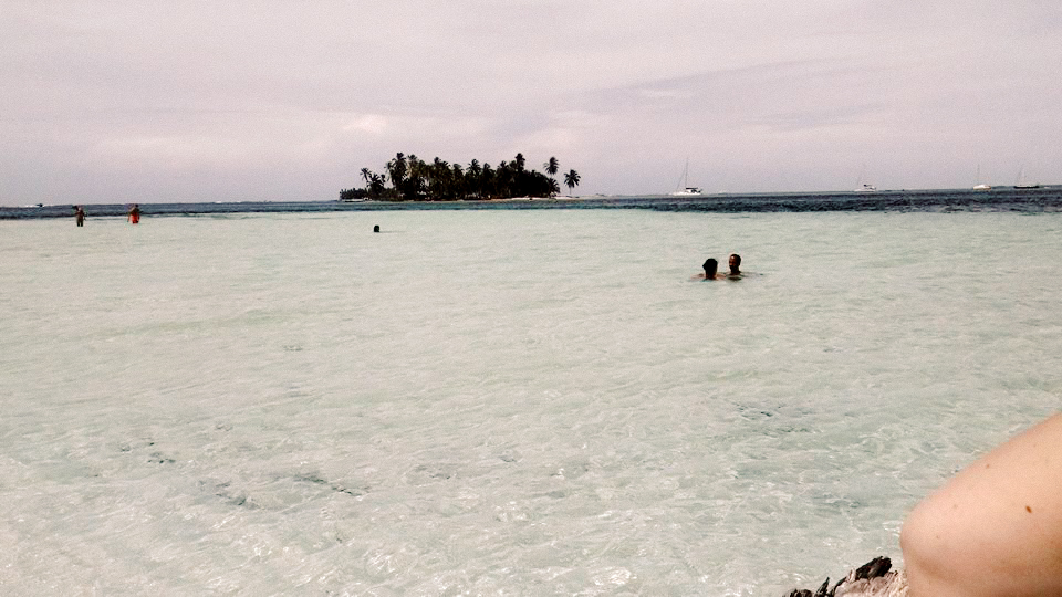 Crystal clear water with an island in the distance