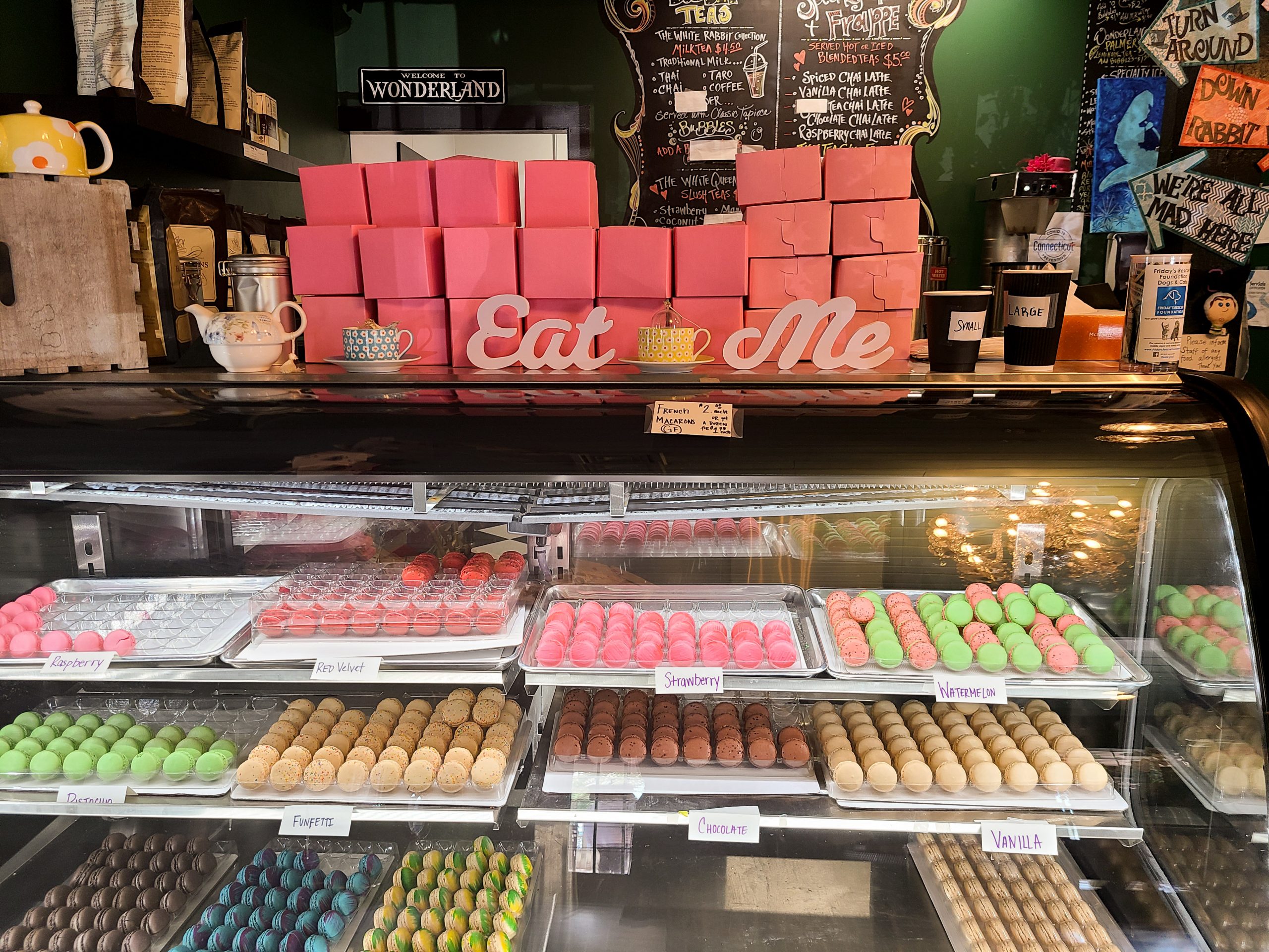 A display case of a variety of colors of macarons