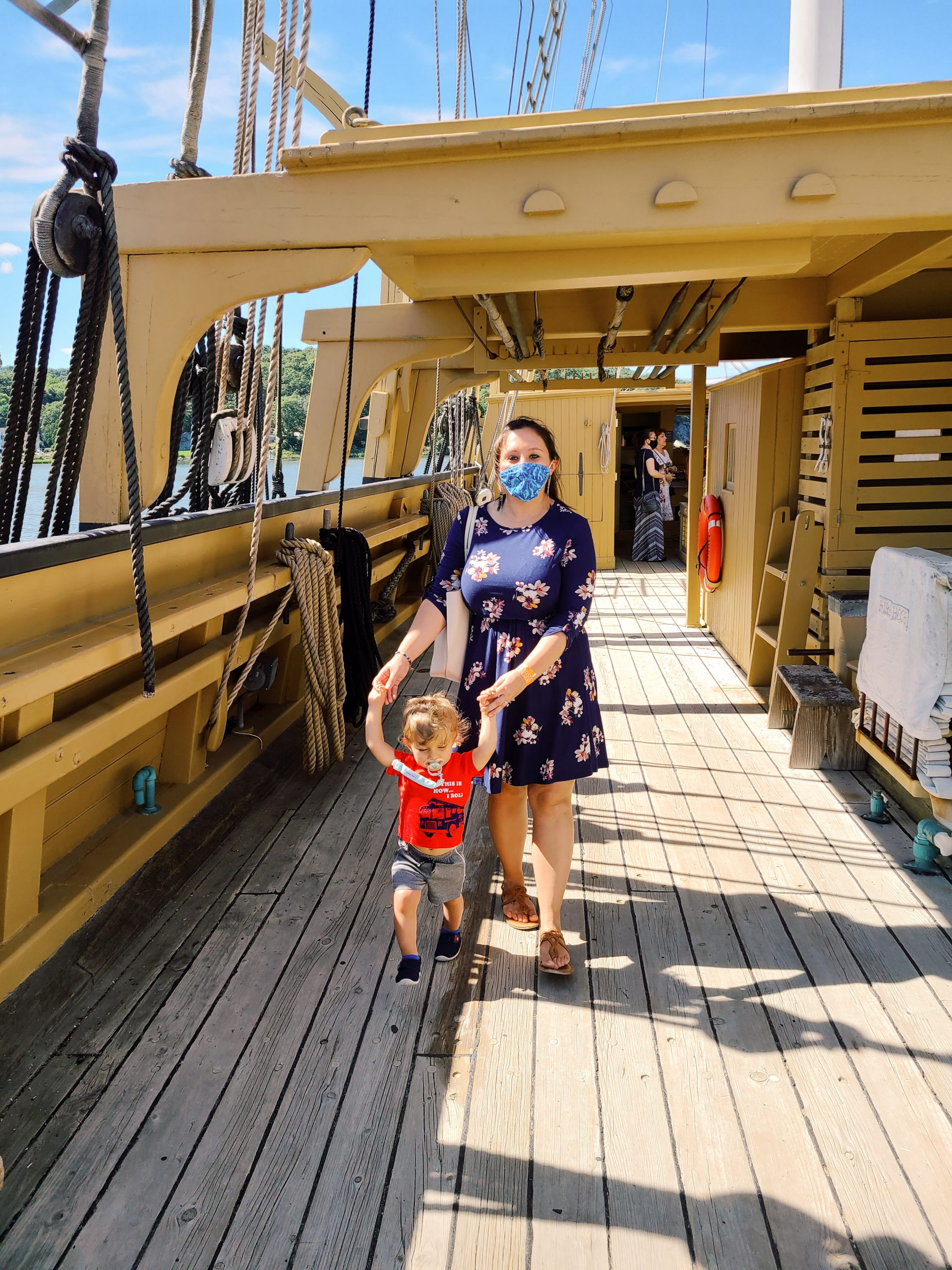 A woman and a child on the deck of ship at the Seaport Museum in Mystic, Connecticut