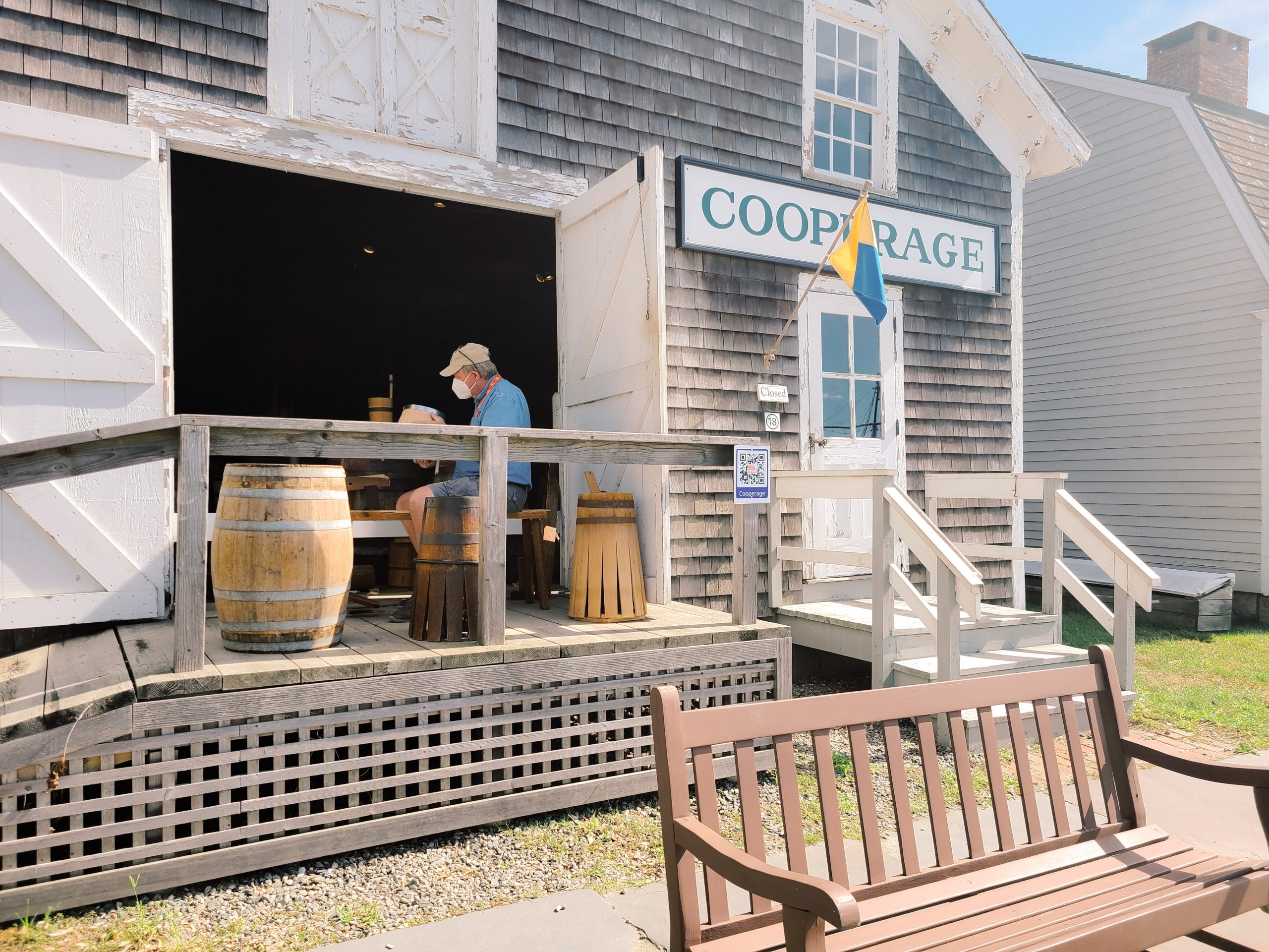 A man works making barrels in the replica of the seafaring village 