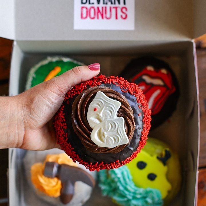 A box of intricately decorated donuts