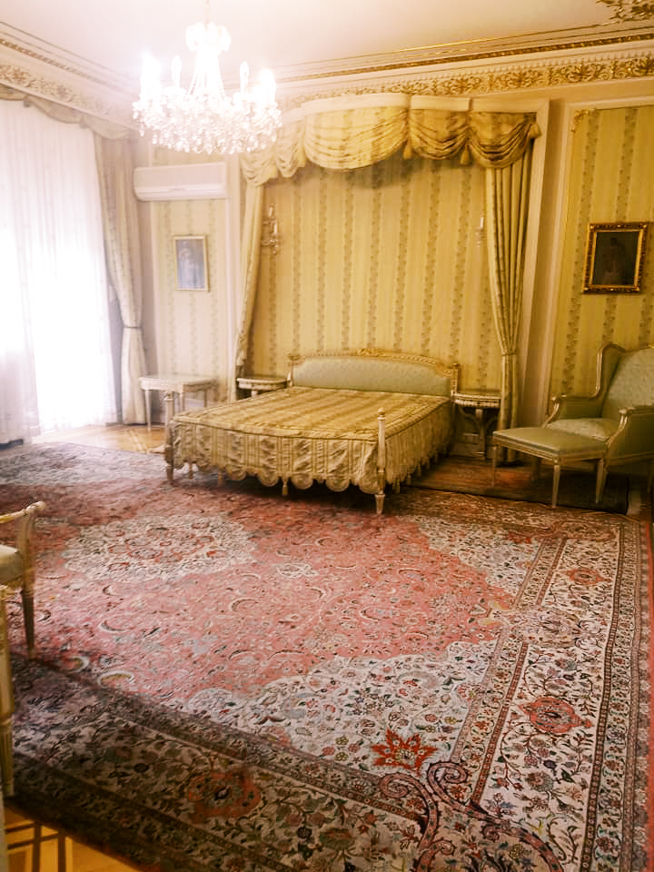 Visiting a bedroom during the Ceausescu house tour