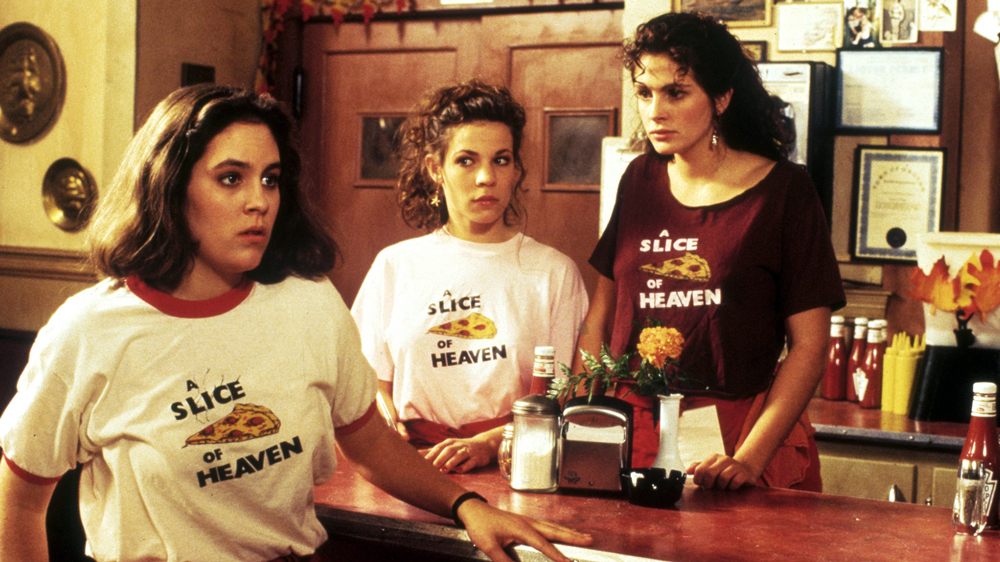 A photo of the three main charactes from the film Mystic Pizza