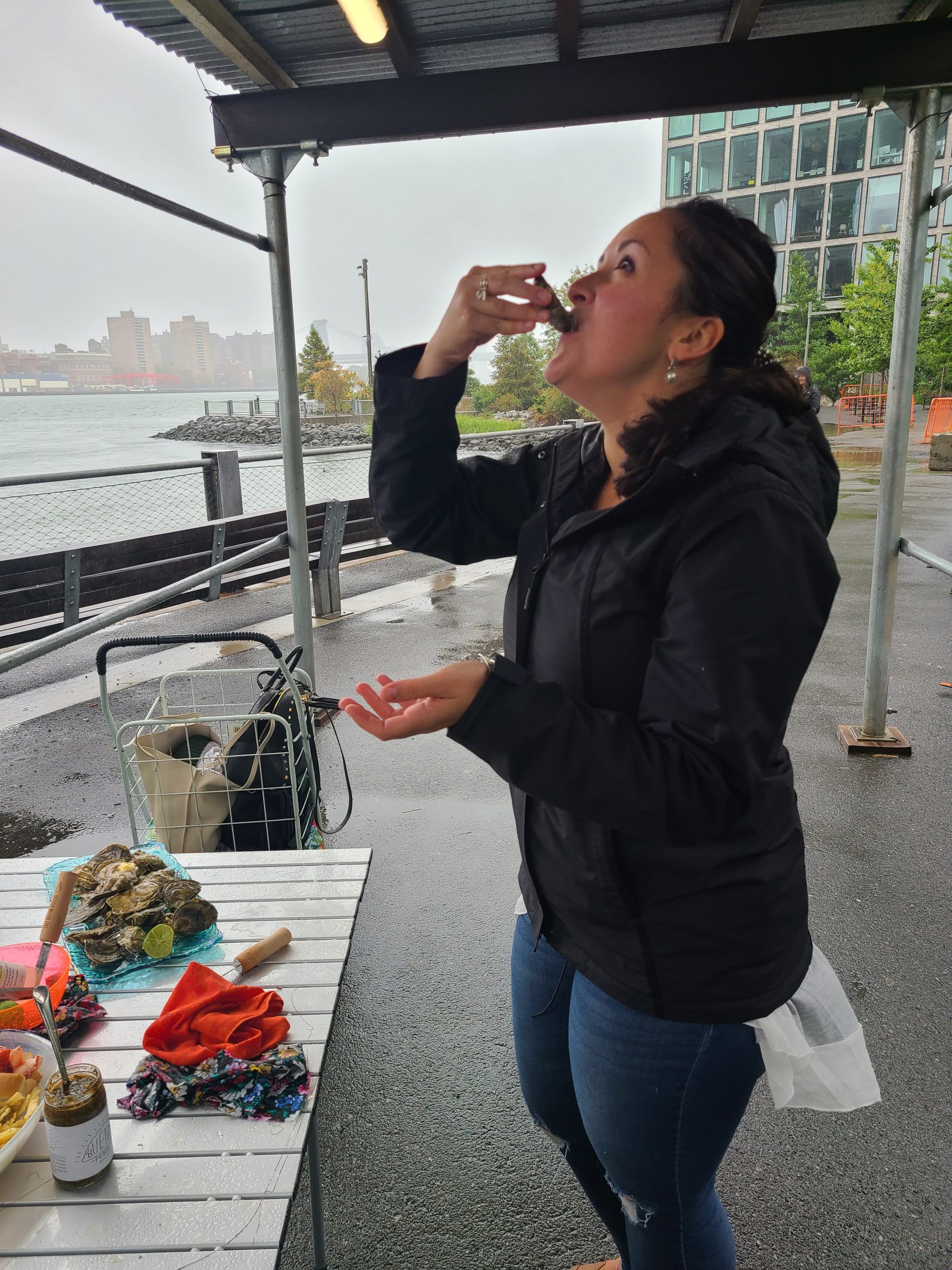 A woman eating an oyster