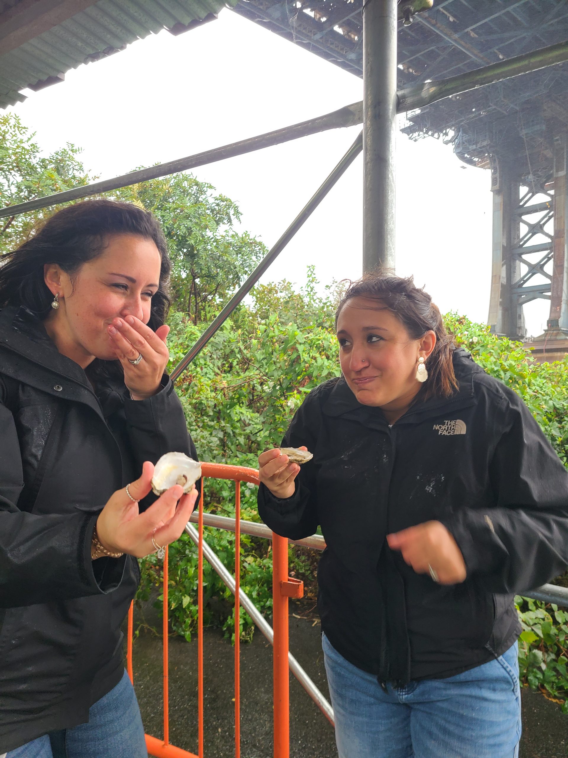 Two women eating oysters