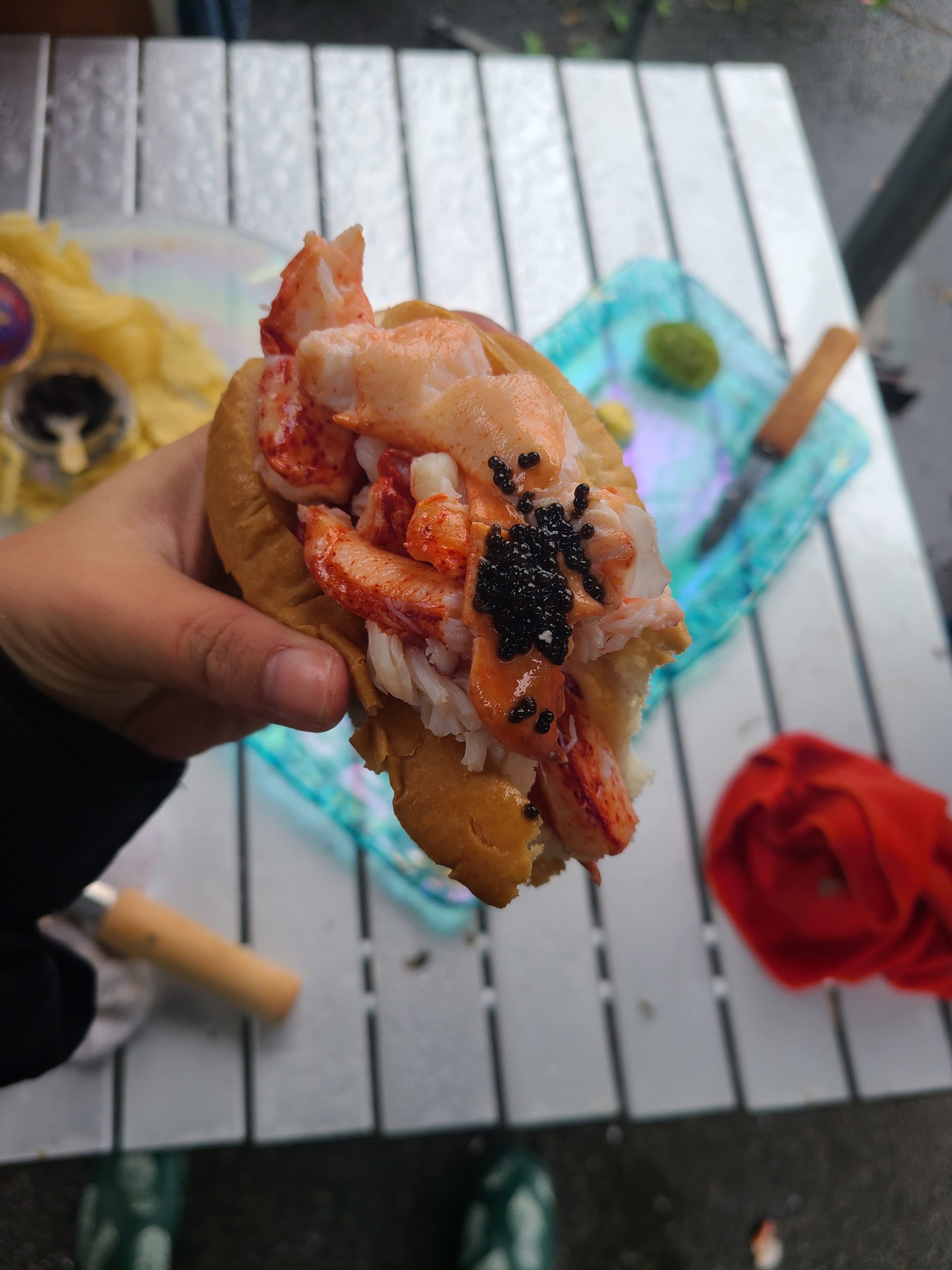Close up of a lobster roll with caviar