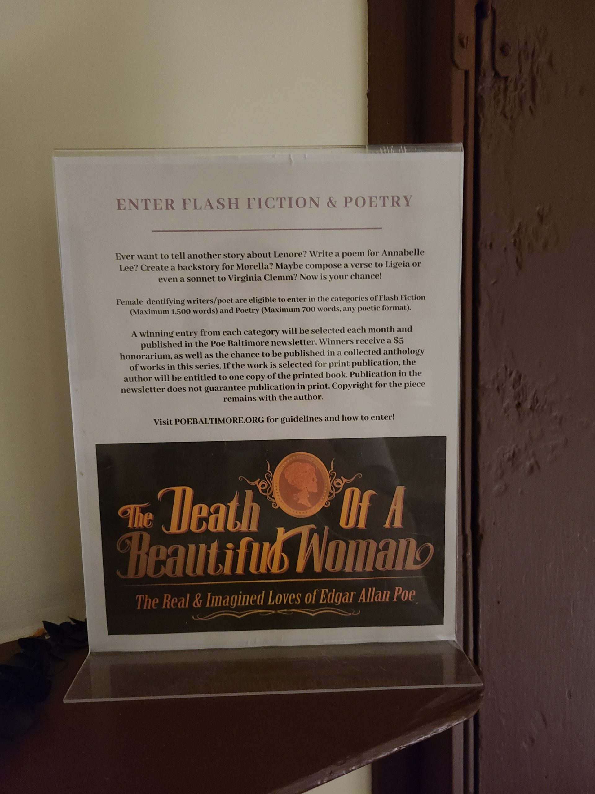 A sign declaring a flash fiction and poetry contest