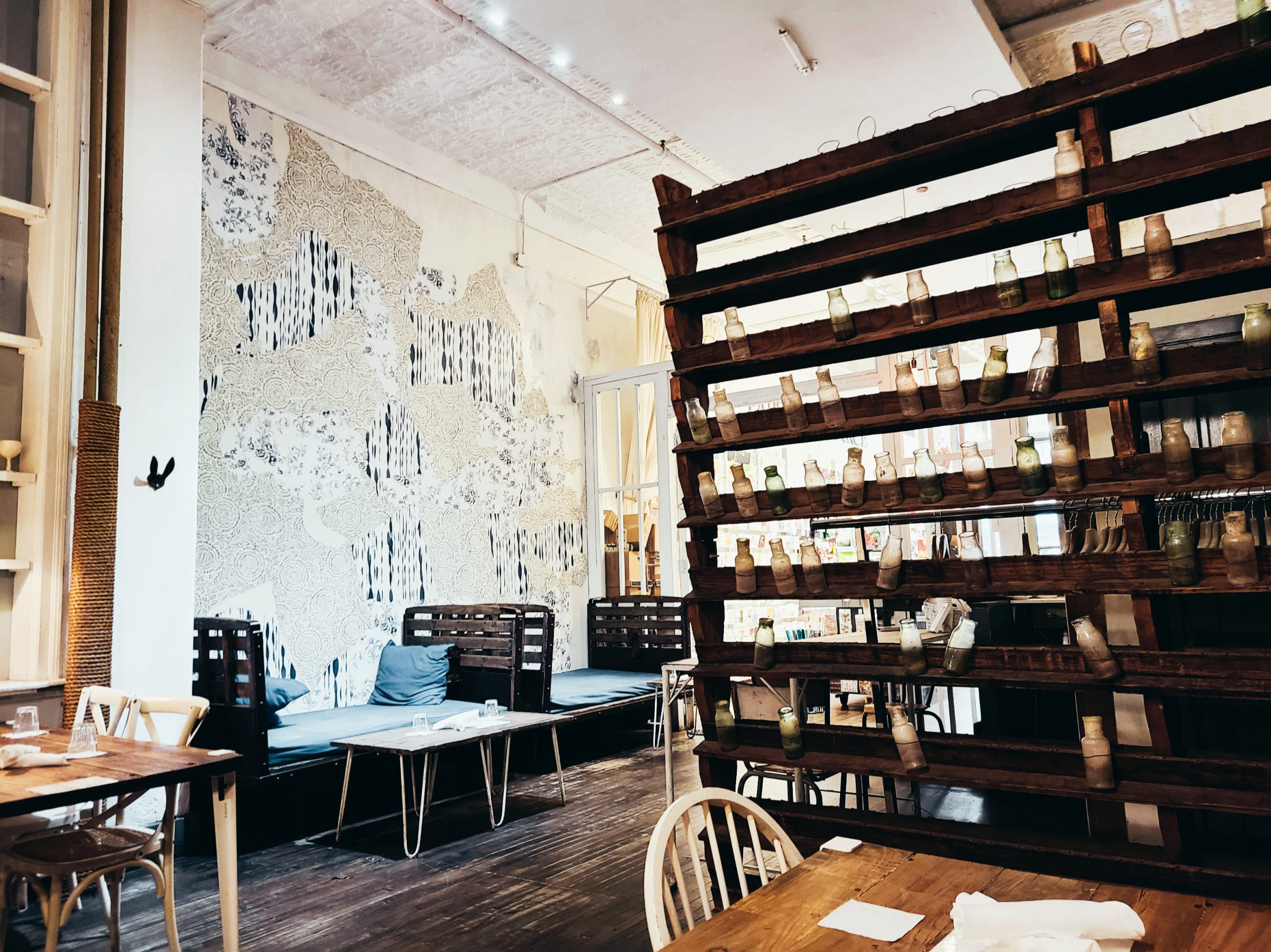 A photo of the tables and sitting areas in Maman Cafe