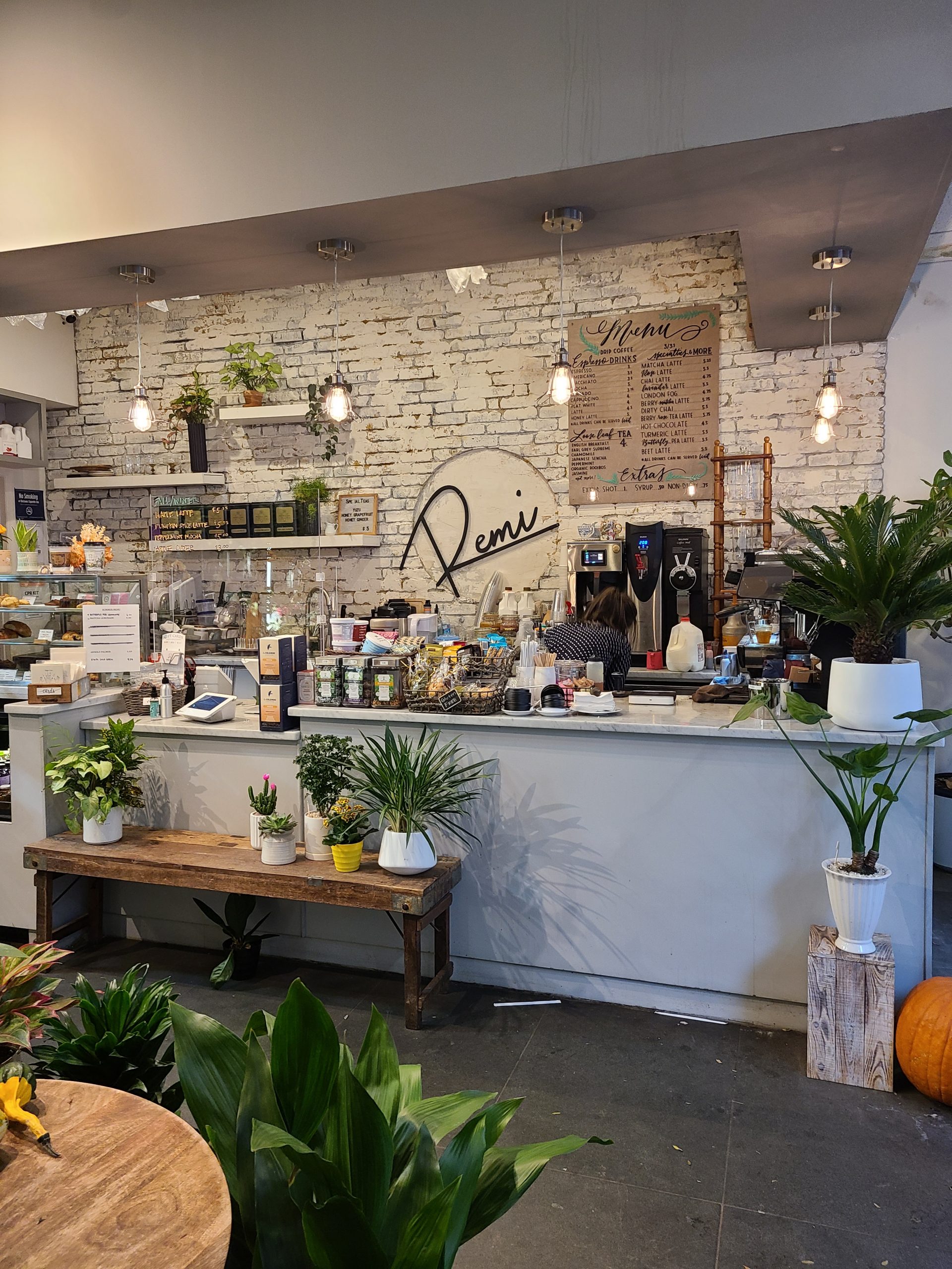 The entry way of Remi Flower and Cafe features a variety of plants