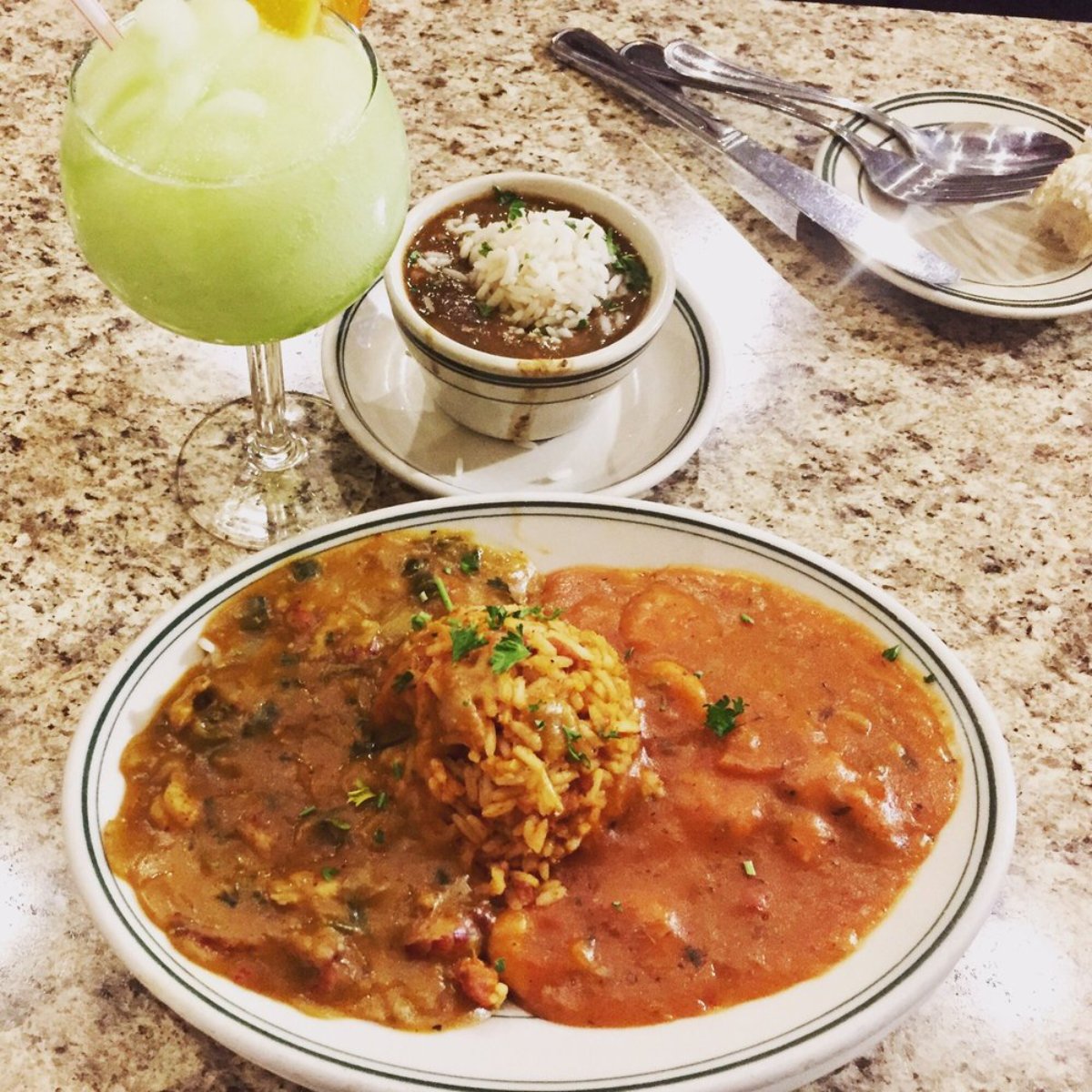 A plate of gumbo and a daiquiri