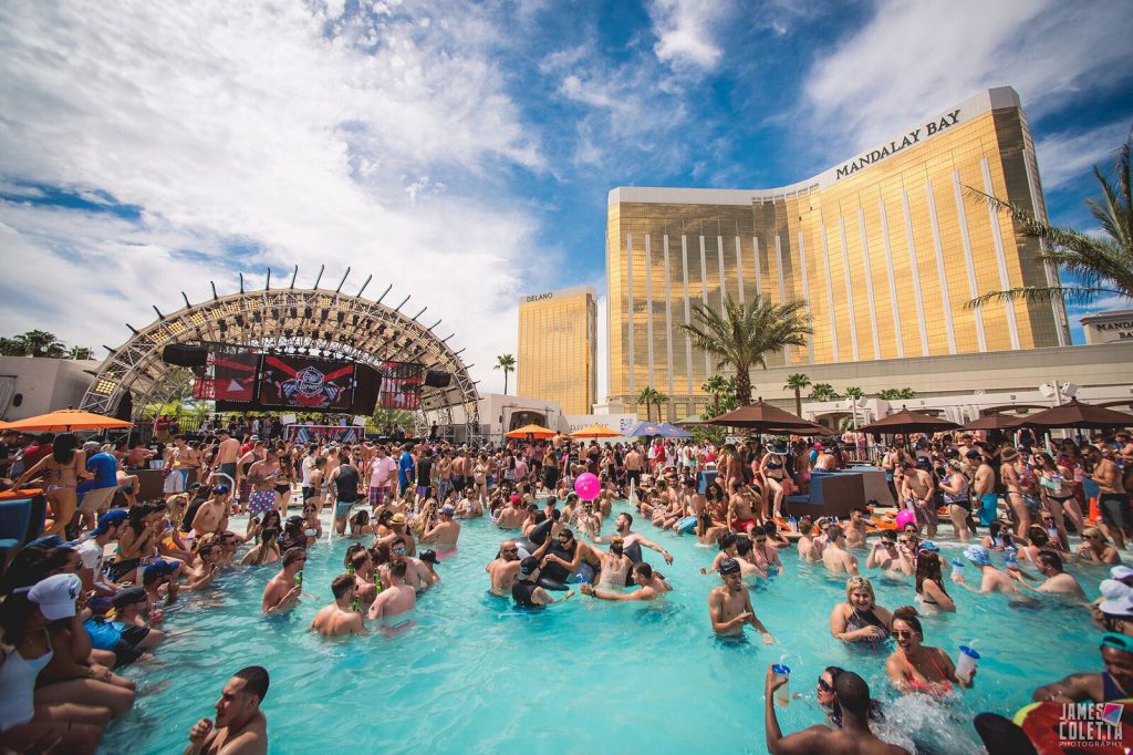 A crowd of people at a Vegas pool party