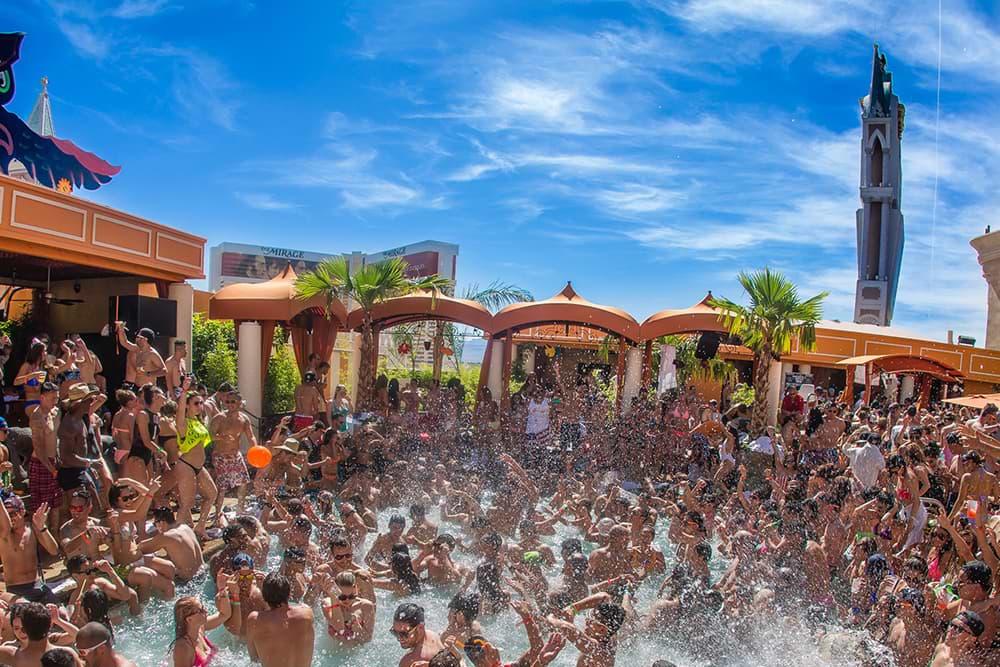 A large group of people fill a pool in Vegas