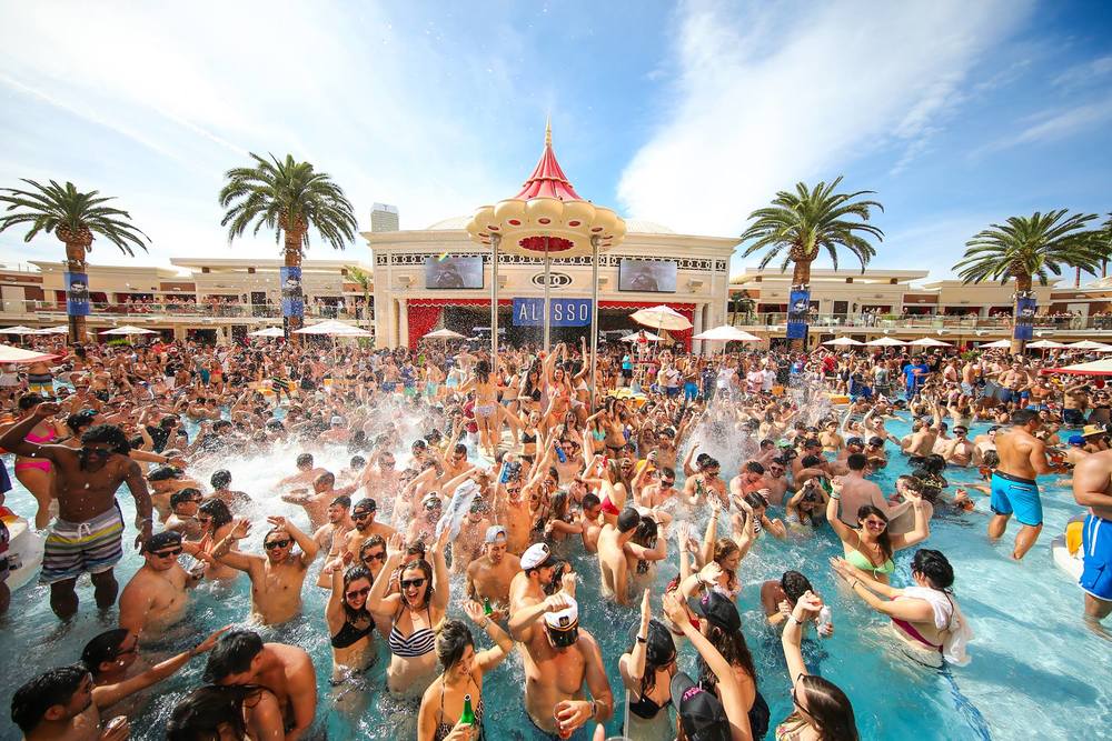 A large gathering of people at a Vegas pool party