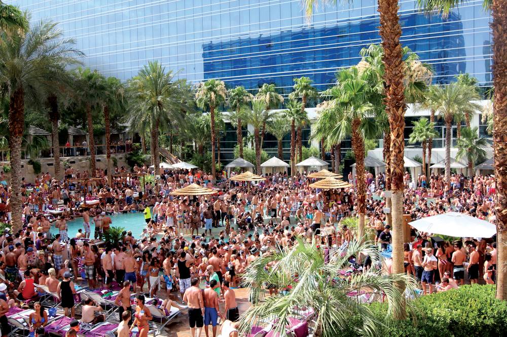 A large crowd of people at the Encore Beach Club in Vegas