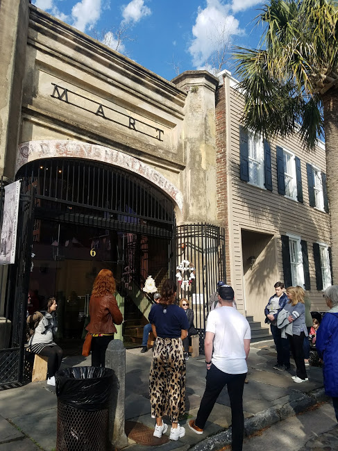 Waiting outside the Old Slave Mart Museum