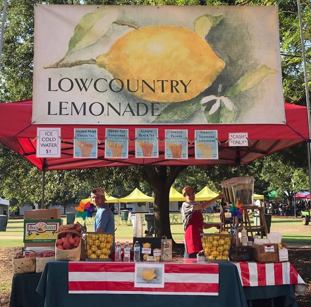 Two men working at a lemonade stand by Low-Country Lemonade